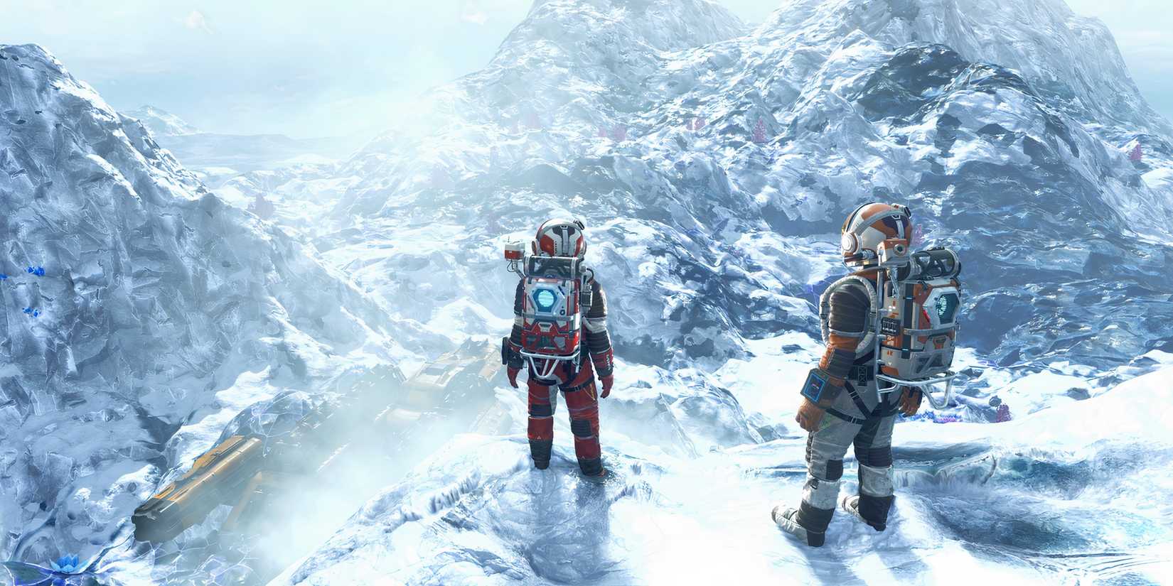 two no man's sky characters standing on a desolate snowy planet full of mountains.